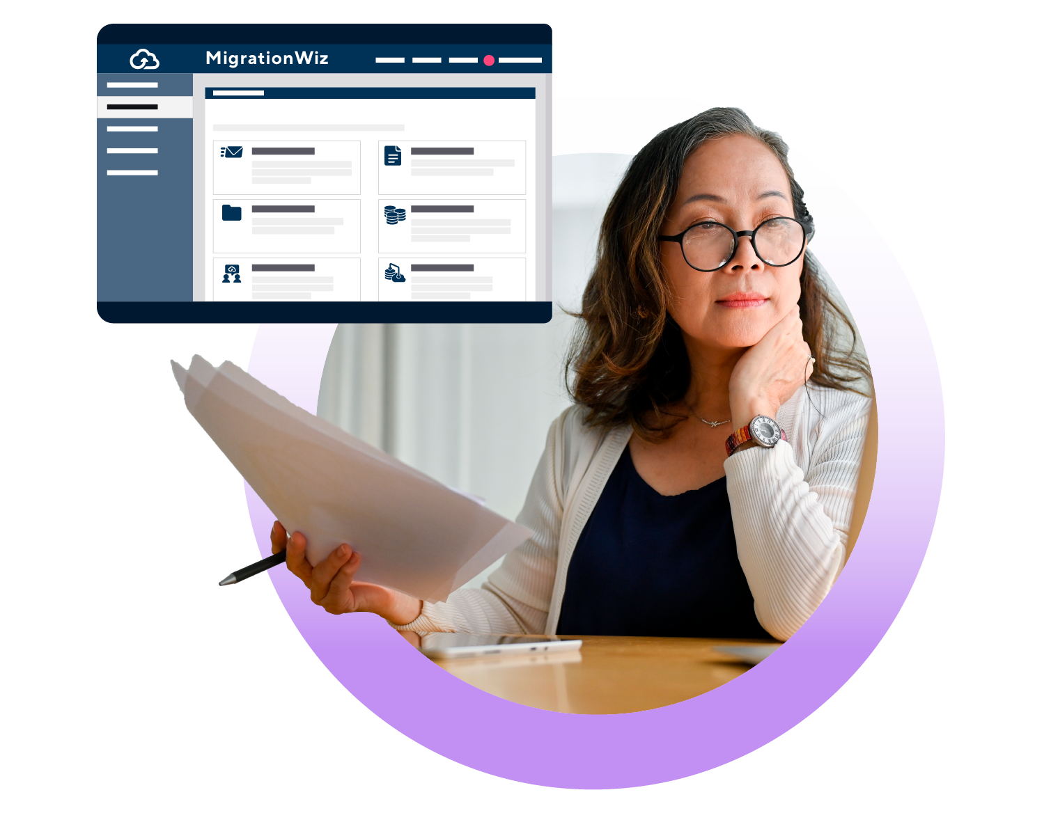 Woman at desk reviewing MigrationWiz platform